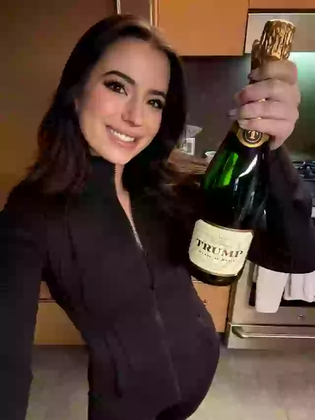 Conservative activist Ashley St Clair celebrates with a bottle of 'Trump' champagne in the days following the election