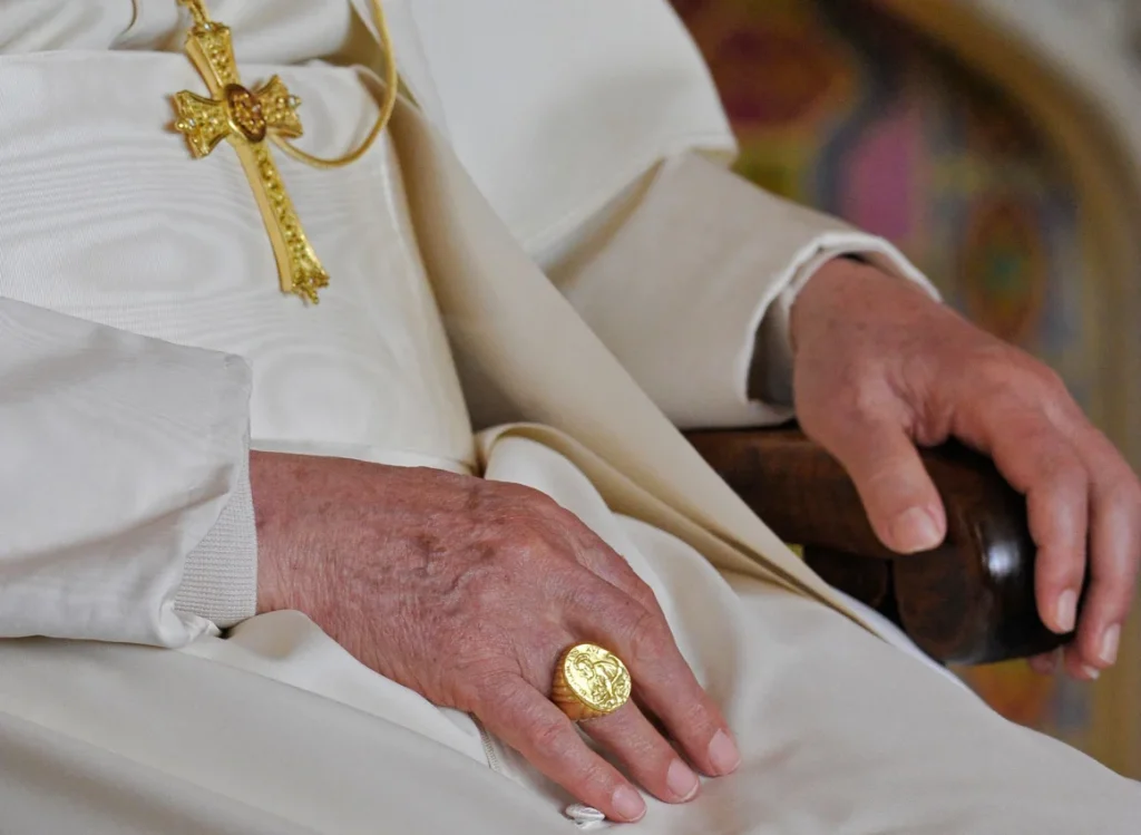 Pope Benedict XVI wearing his Fisherman's Ring during a meeting of religious leaders in London in 2010, less than three years before he became the first ever pope to resign.